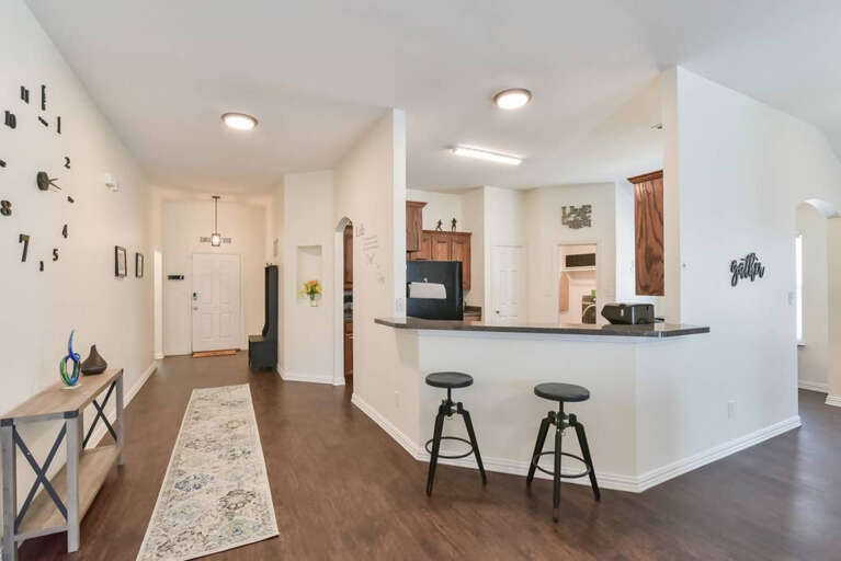 A view in the center of the home from a great seating area at the kitchen bar.