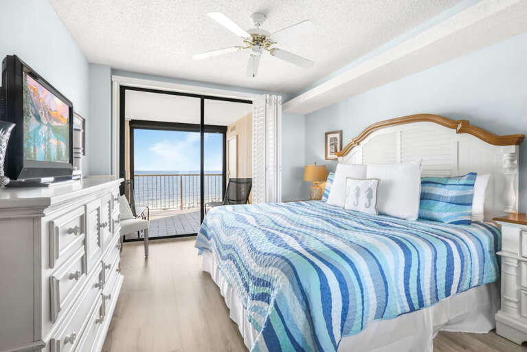 King bed in the master bedroom with access to the balcony