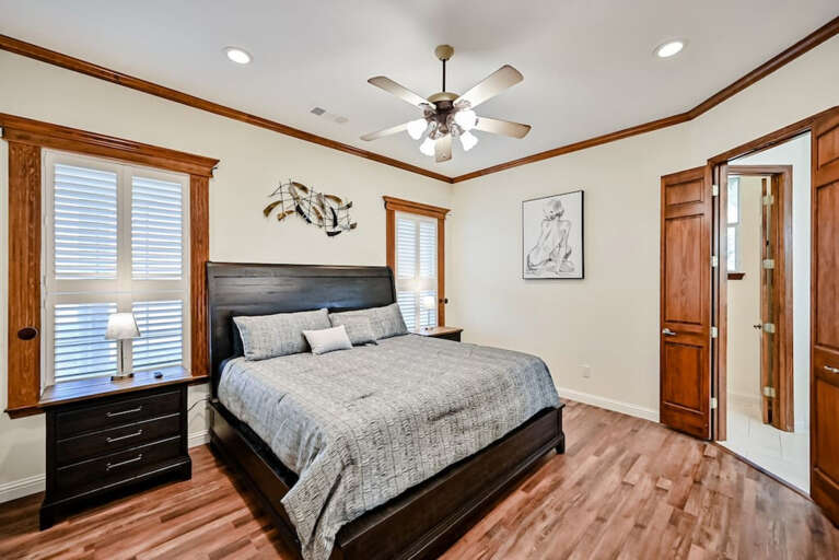 Master bedroom with California King bed, USB port charging side lamps on nightstands with extra plug-in strips on back of each nightstand.