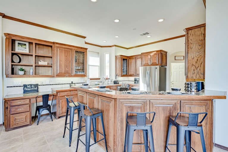 Spacious, open kitchen with bartop seating
