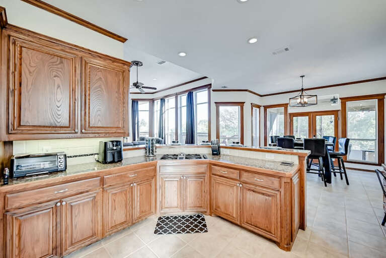 View of open kitchen with dining room in background