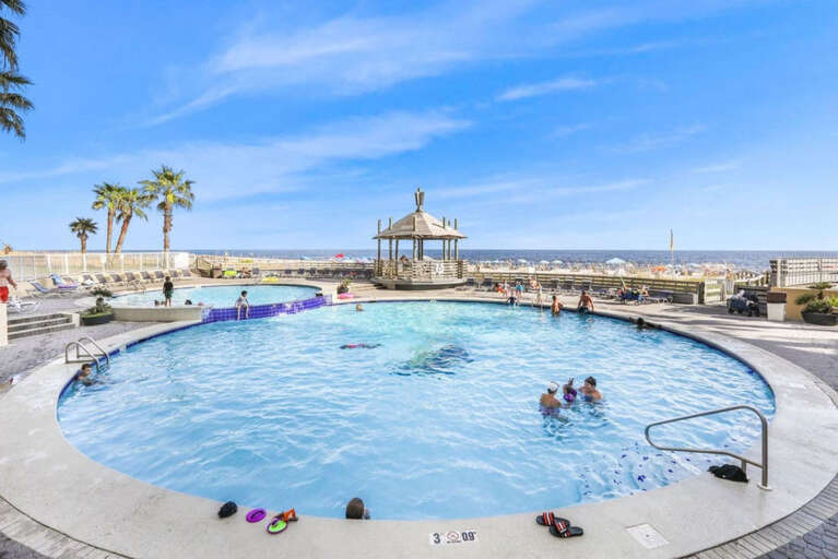 Central pools below unit, between building and beach, toward private beach entrances Central pools below unit, between building and beach, toward private beach entrances