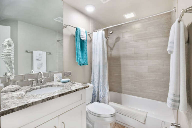 Secondary bathroom with updated counters and shower Secondary bathroom with updated counters and shower