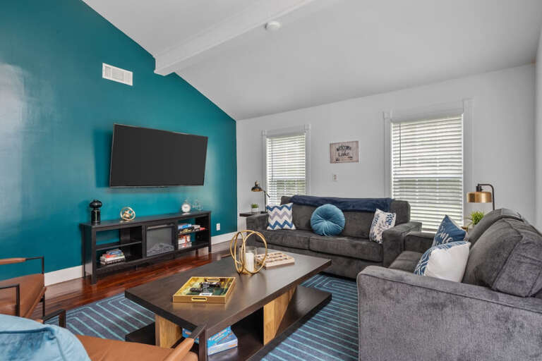 Living Room with Smart TV, couch sitting areas, and sofa bed couch