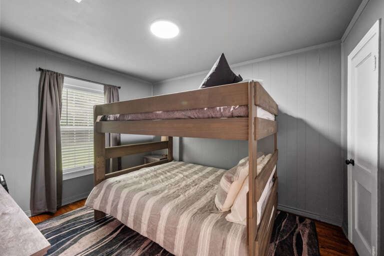 3rd bedroom with Queen Bunk Beds, Smart TV, Dresser, and closet