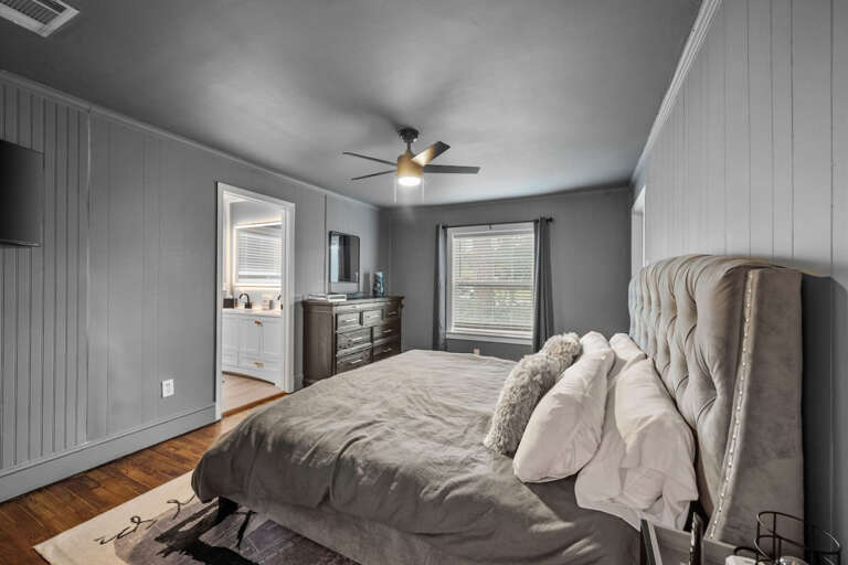 Primary Bedroom with en-suite bathroom, king bed, and smart tv with access to streaming channels