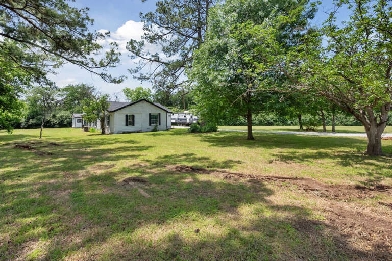 View from the road of the large space in the front of the home