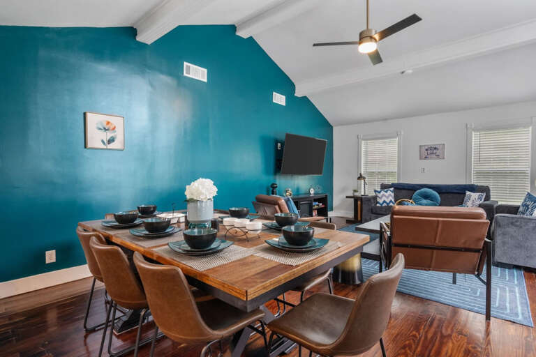 8 Seater dining room table with view toward living room seating areas