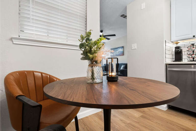 Dining room table area in the kitchen, seating for 2