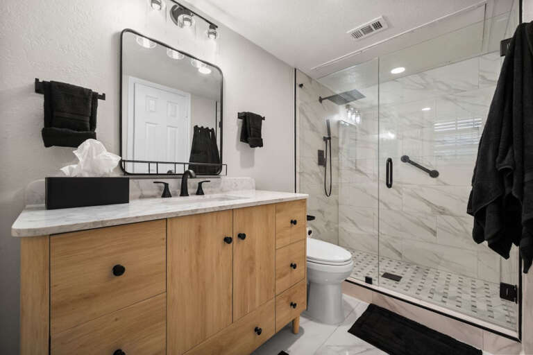 Freshly renovated en-suite bathroom with new rain shower and vanity