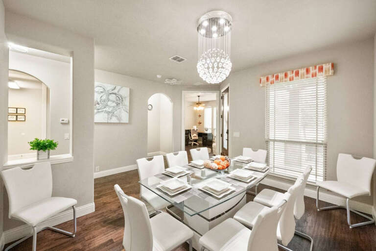 Front Dining, with seating of 6-8 people, located right after entering front door with view toward office and front entry