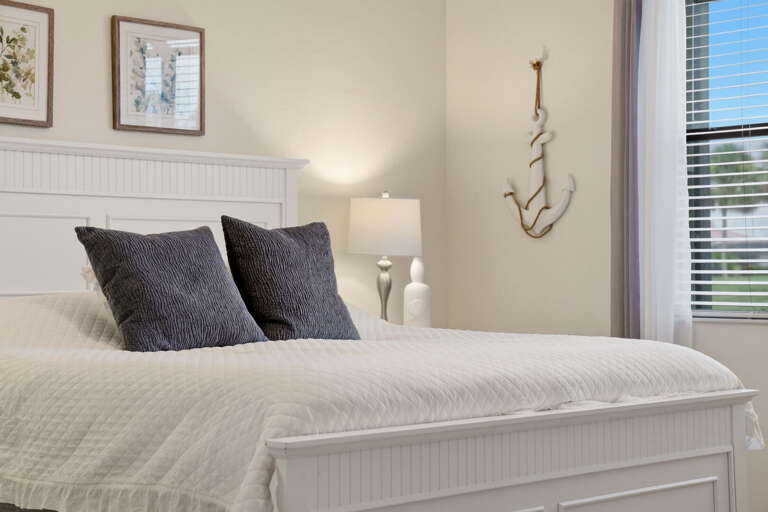 Bright and airy, with a window looking out toward the golf course and palms.
