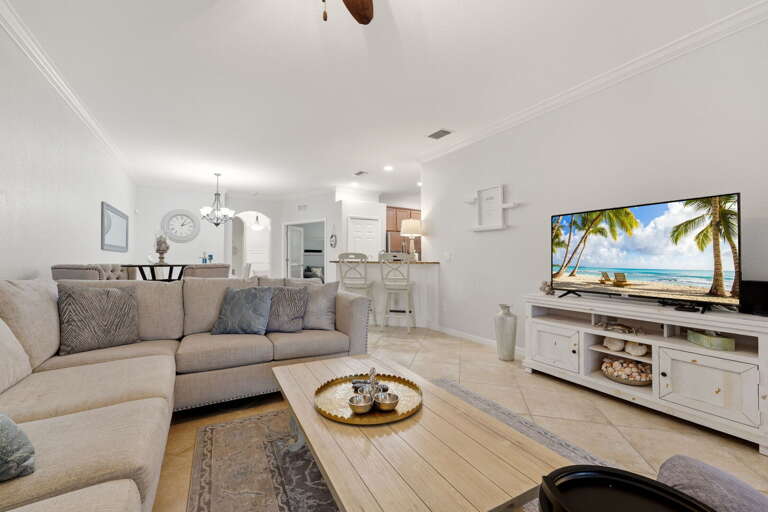 A relaxed coastal living room just steps from the breakfast bar.