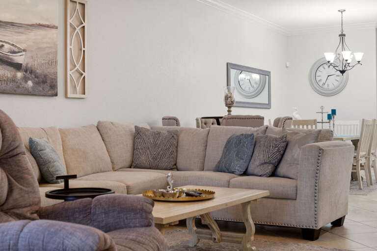 Sectional seating with a clear view through to the dining table beyond.