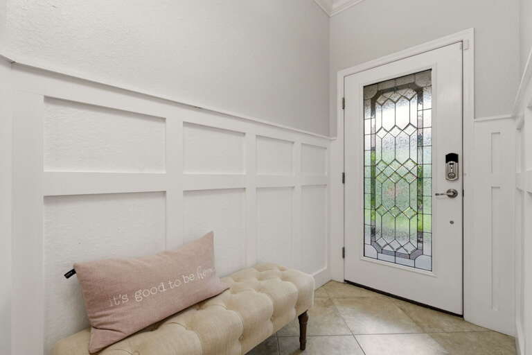 Step into a bright, tiled foyer with easy coastal style.