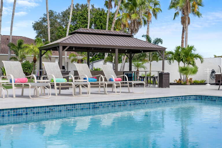 Drop your bags, grab a lounger, and let the afternoon disappear — your private pool is surrounded by palms, a lit gazebo, and enough deck space for the whole crew to claim a spot.