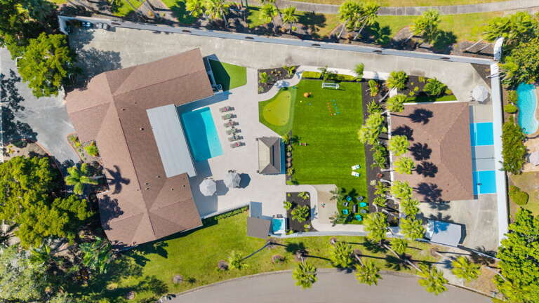 Your two-house compound side by side — Heated Pool, wide turf lawn between them, and room for all 23 of you.