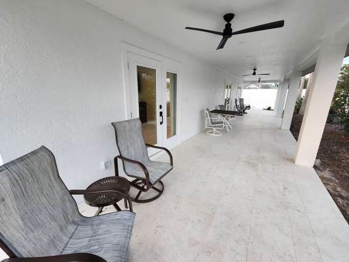 Your long covered back porch has rocking chairs and ceiling fans — drink your morning coffee out here while the property wakes up around you.
