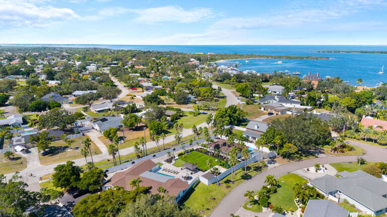 Your property from the drone — bay and marina visible in the background, and the Gulf just a short drive away.