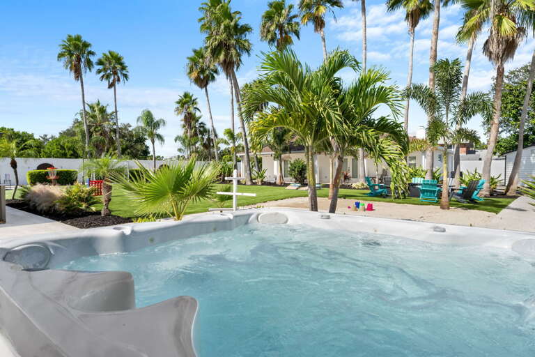Sink in after dinner with the jets on full — your Adirondack chair is right there when you're ready to dry off, and the fire pit is already lit.