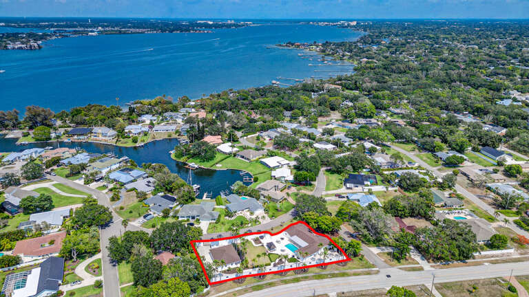 Zoom out and you see it: the whole estate outlined, pool, and the bay waterfront in the background. Minutes from the Gulf and your own piece of paradise right here.