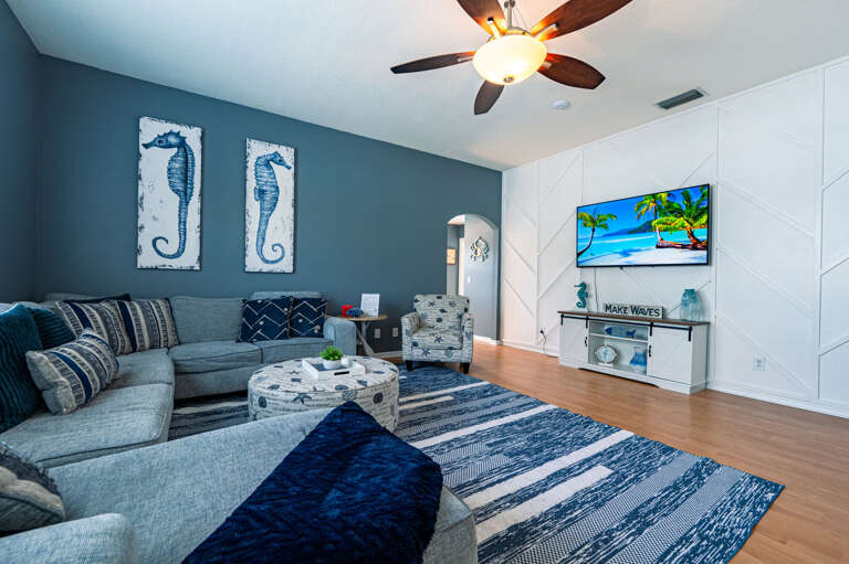 Sink into ocean blues without leaving your couch — the living room feels like a seaside escape year-round