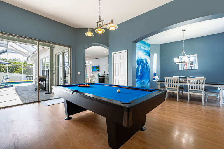 Your transition from game room to pool deck is seamless — finish a round, step outside, and cool off