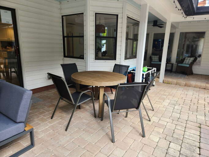 Carry your plate outside and eat under the sky. This table's built for your whole group at once.