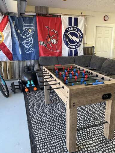 Claim next game before you even set your drink down. This table never sits empty for long.