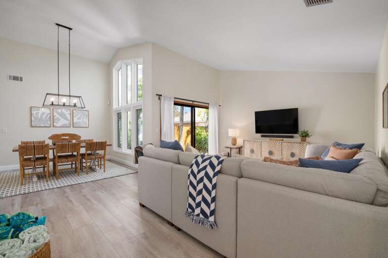 Keep your conversation going from the couch to the table. This room never really splits your group up.