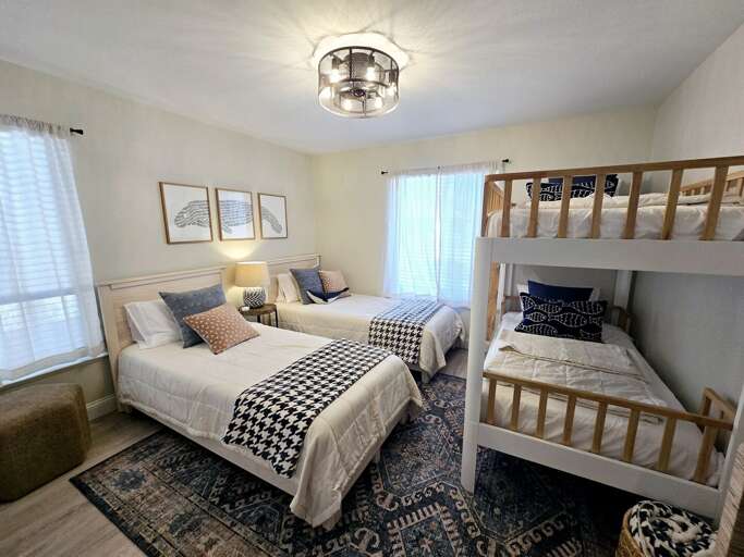 Let the kids call top bunk the second you walk in. This room was built for exactly that argument.