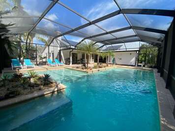 Slide into the screened lanai and let your whole afternoon disappear by the water.