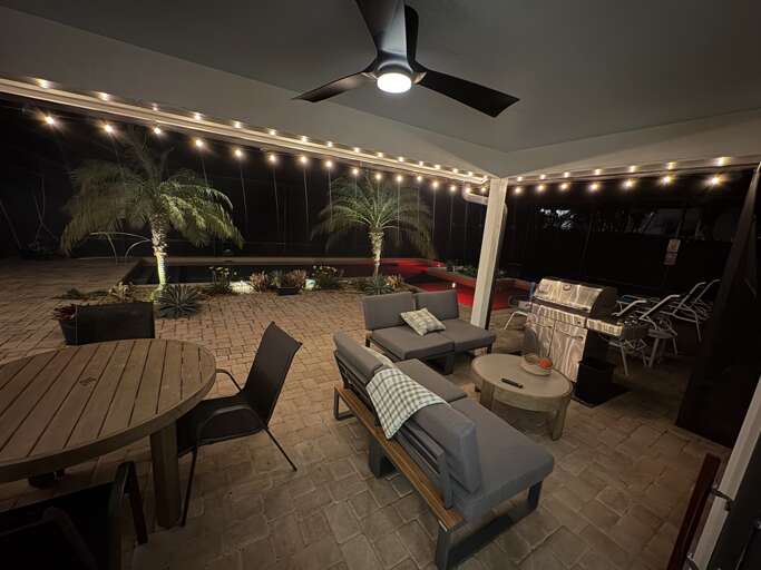 Trade the pool for the porch once it cools off and let your evening stretch out under the string lights.