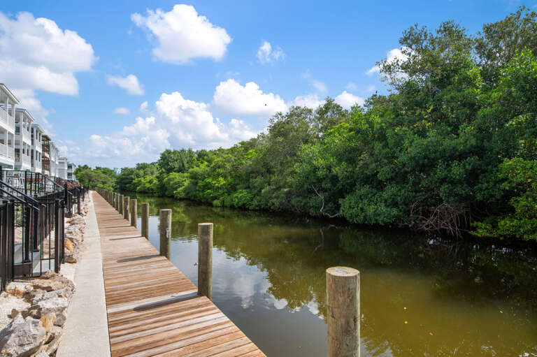 Walk down the boardwalk, launch a kayak into the canal, and disappear into the mangroves for the afternoon. It connects straight to the bay when you're ready to venture further.