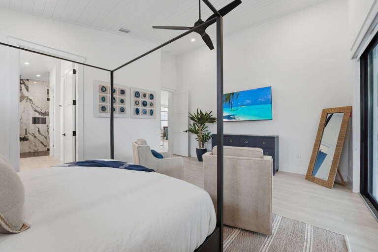 Claim the primary suite — king bed, private spa-like ensuite, pool access, and a Smart TV for the nights you stay in.
