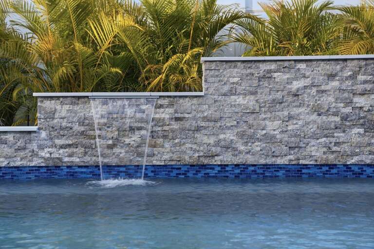 Take the covered outdoor living space as your base — Smart TV set up, pool steps away, shade overhead when the Florida sun gets serious.