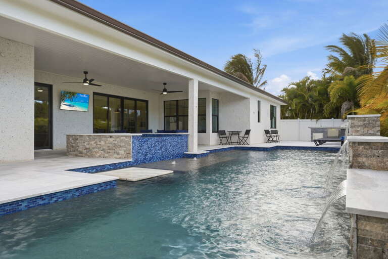 Find your seat in the corner of the hot tub and stay there — built-in seating, jets aimed right, no awkward perching on the edge.