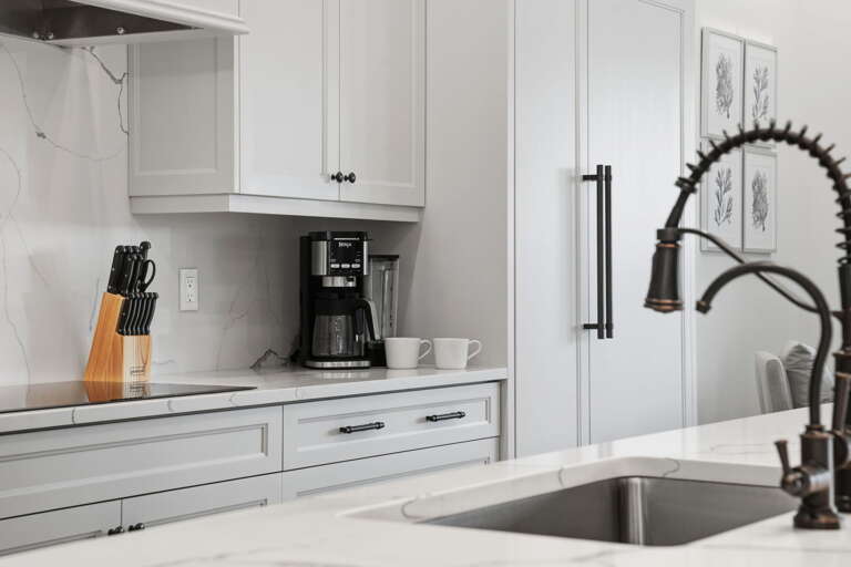 Open the refrigerator, find the oven already preheating, and realize this kitchen handles a big-group dinner without breaking a sweat.