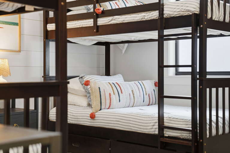Picture the kids in these bunks and remember every trip where sleeping arrangements were the drama — this isn't that trip.
