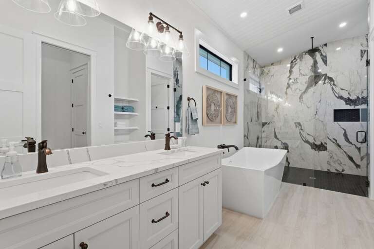 Step into the full bathroom and find everything you need — clean fixtures, full tile, no waiting for someone to finish in the hallway.