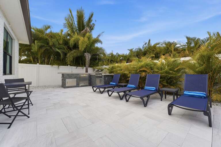 Walk the exterior and you'll see it: clean lines, contemporary build, a home that holds its own in any coastal neighborhood.