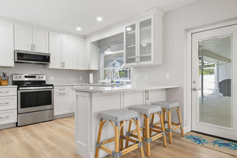 Grab a snack and step straight to the pool — the kitchen sliding door is the best shortcut in the house.