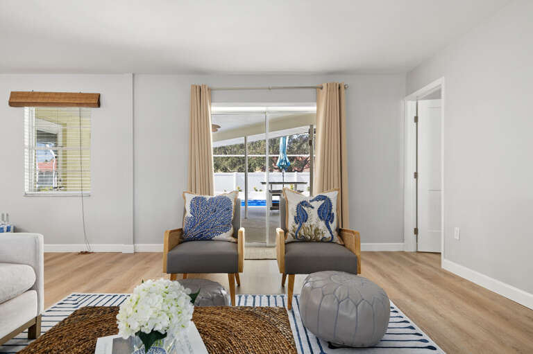 Pull up one of these chairs and slide the door open — let the pool breeze do its thing while you decompress from the drive.