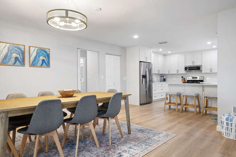Seat everyone at once and serve straight from the kitchen — eight chairs, plenty of elbow room, and no one stuck at the kids' table.