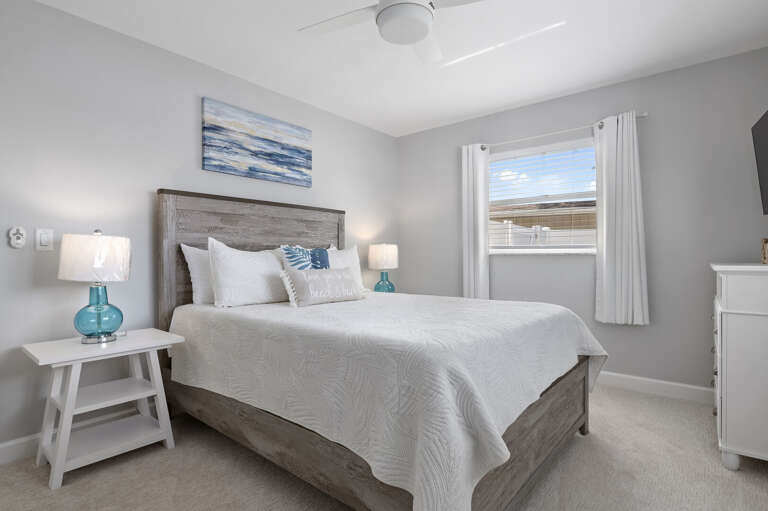 Sink into bed and let the soft coastal palette do the rest — your guests will fight over this room.