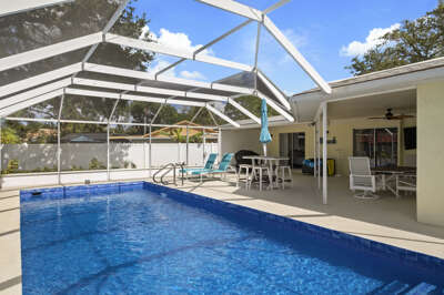 Sink into the pool or stretch out on a lounger — your screened Florida oasis is waiting the moment you arrive.