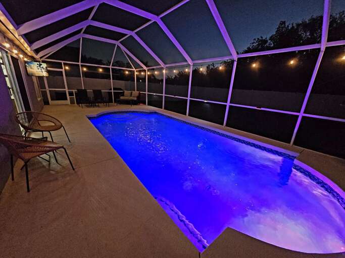Grab a spot on the outdoor sofa, listen to the water, and let the string lights do their thing — this is the evening vibe.