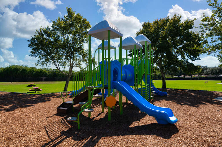 Let the kids burn energy while you decompress — the community playground has a full multi-unit setup right inside the neighborhood.