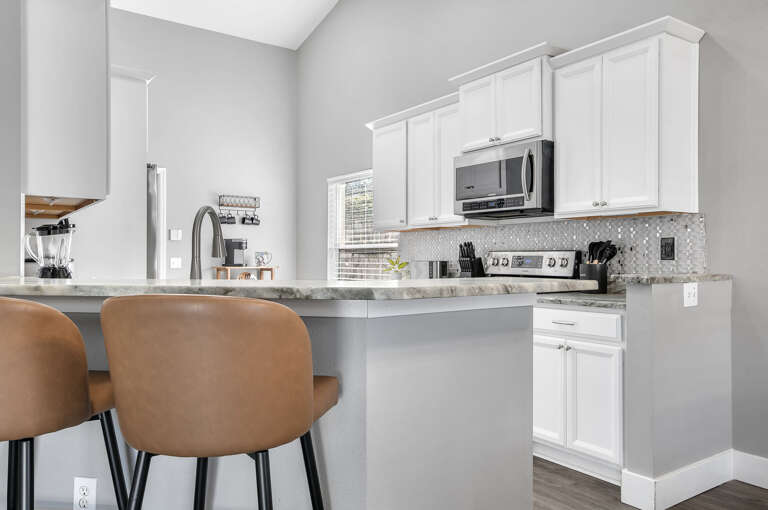Pull up a stool at the peninsula — breakfast, a glass of wine, or just keeping the chef company, this counter does it all.