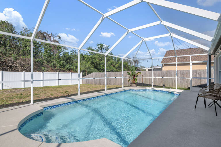 Swim laps or float for hours — the pool runs the full length of the enclosure with room for the whole group.
